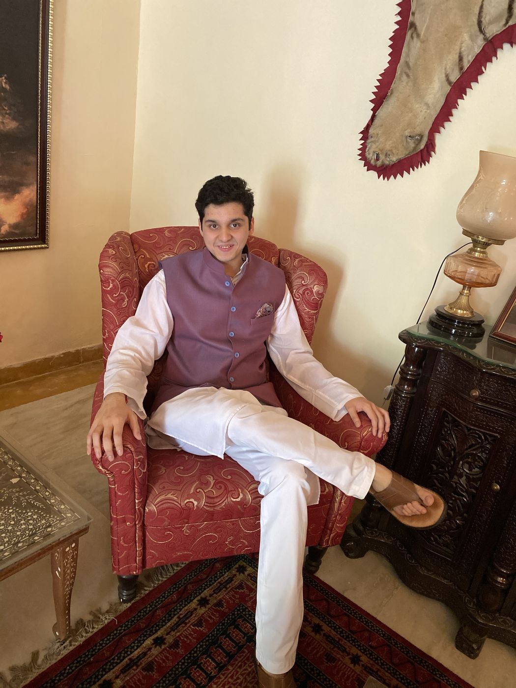 Seated at home in a lilac Nehru jacket