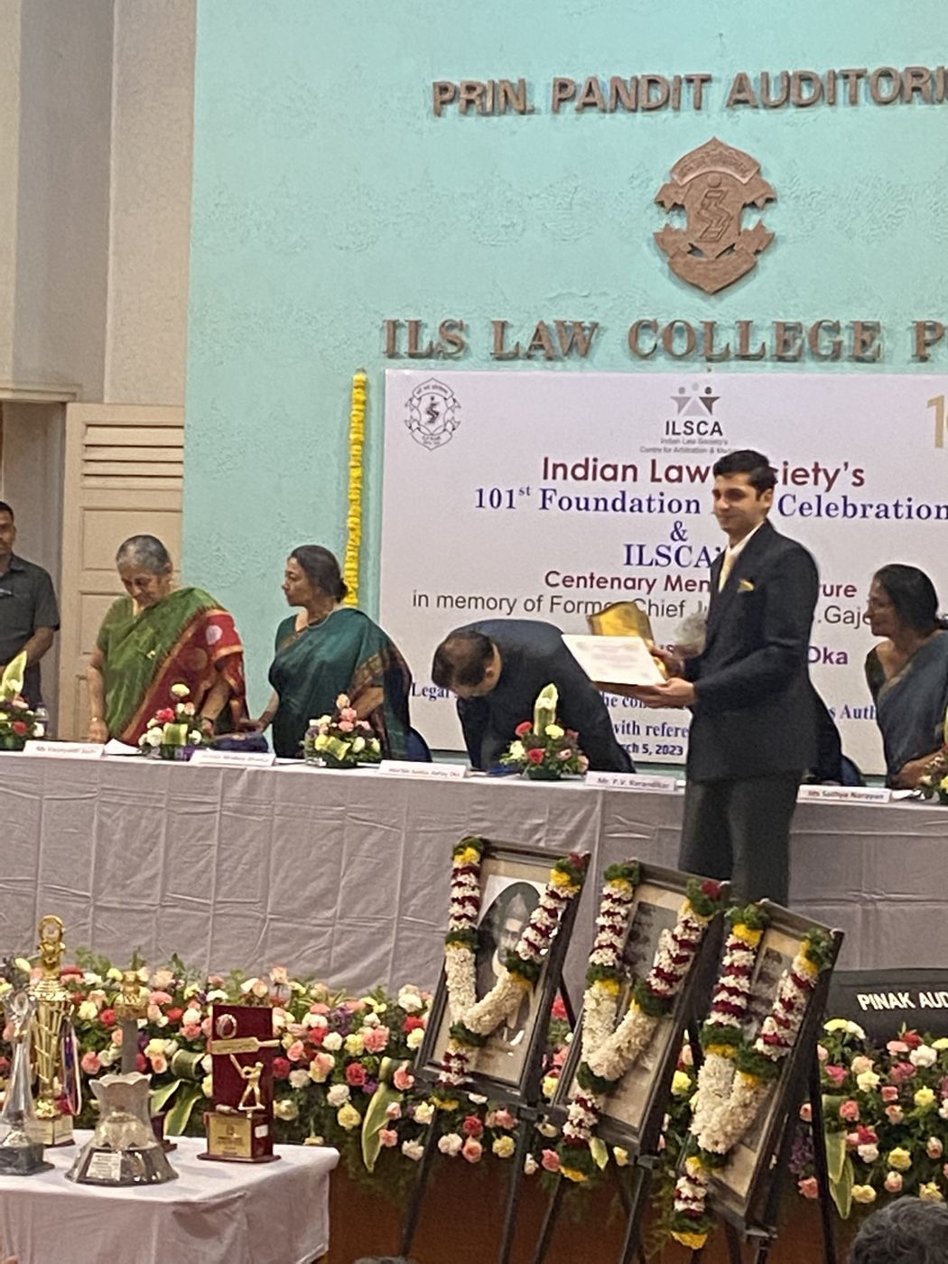 Receiving the legal aid award at ILS Law College