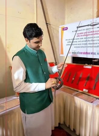 Inspecting historic arms at an exhibition